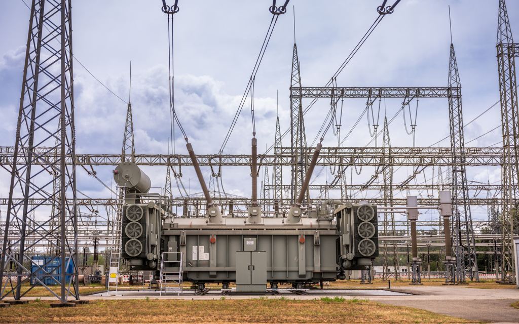 Power transformer in an AIS switchyard — transformer digitalization monitors thermal, mechanical, electrical and chemical condition (transformer digitalization brochure photography)